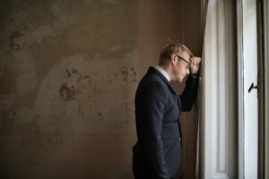 man with head on wall