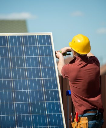 Worker Installing Photovoltaic Panel